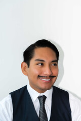Eccentric Latin man with mustache posing on the white background