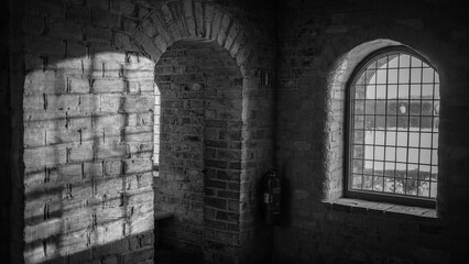 Light reflects through an old window inside a castle about an hour outside of Stockholm, Sweden. 