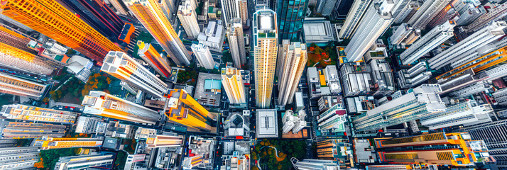 Aerial View of a Bustling City: Drone Shot Over Hong Kong, Capturing the Dense Urban Landscape and Architectural Diversity