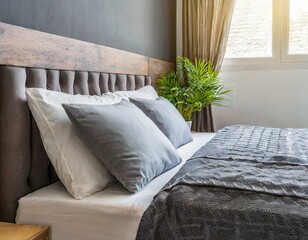 Concept of sleep hygiene, cosy bed with soft pillows and comfortable sheets, set in a peace, idea for bedroom and hotel room interior design in scandinavian style