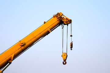 Construction site with yellow crane