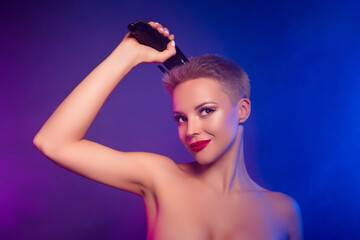 Photo of girl cutting hair with professional barber equipment look vivid ultraviolet mist color background