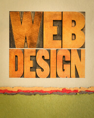web design word abstract in vintage letterpress wood type on art paper, internet service concept