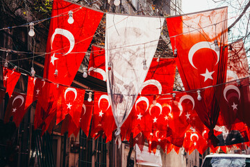 Garlands of festive turkish flags on one street of Istanbul, Turkey. - 750223404