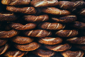 Freshly baked traditional turkish simit bagel on sale in a local bakery in Istanbul, Turkey. - 750223405