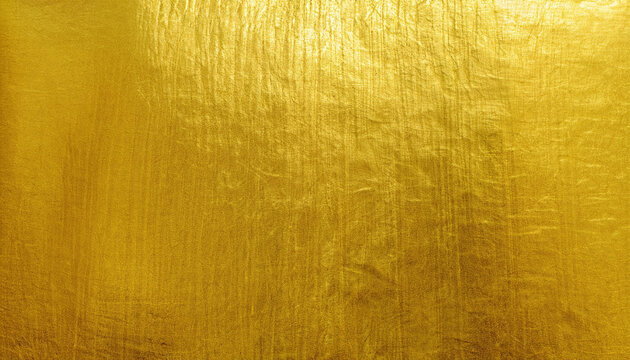 Shiny yellow leaf gold foil texture background; beautiful brushed metal effect; vertical