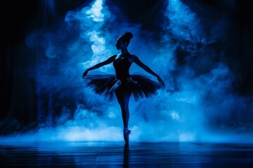 Ballerina in black tutu dancing on stage with blue light and smoke silhouette of young dancer in ballet shoes pointe in dark