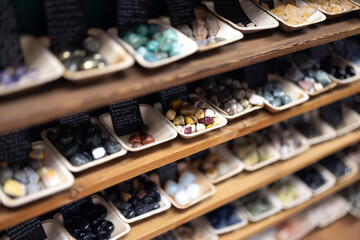 Rocks in a display case in a small shop with crafts and decorations