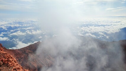 Smoke from inside the crater of an active volcano in Indonesia