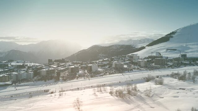 Aerial shot of hotels and an Alpine ski track in famous Alpe d'Huez ski resort, France