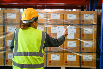 operation worker woman checking and inspecting cargo for stack items for shipping. Staff checking the store factory. industry factory warehouse. Worker Scanning Package In Warehouse. - obrazy, fototapety, plakaty
