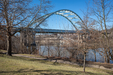 Birmingham Bridge across the Allegheny River with blue sky seen from Three Rivers Heritage Trail,...