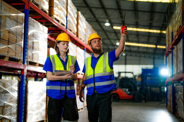 operation workers checking and inspecting cargo for stack items for shipping. males worker checking the store factory. industry factory warehouse. Worker Scanning Package In Warehouse.