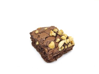 Brownie cake with bitten peanut topping isolated on white