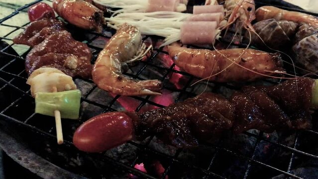 February 14, 2022 - Jomtien Beach, Chonburi Thailand. A barbecue full of meat and seafood at an all you can eat, Thai barbecue buffet.