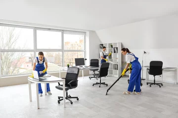 Fototapete Young janitors cleaning in office © Pixel-Shot