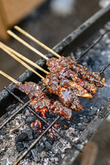Beef maranggi satay is being grilled
