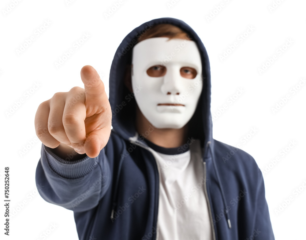Aufkleber hacker in mask pointing at viewer on white background, closeup
