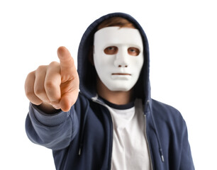 Hacker in mask pointing at viewer on white background, closeup