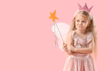Thoughtful little fairy on pink background