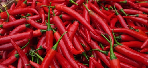 Pile of big Red Chili Peppers background ready sold in traditional market Indonesia. Vegetable chili ingredient for cooking