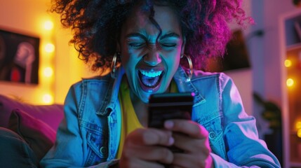 A player excitedly celebrates after achieving a new high score their phone screen illuminated with their victory.