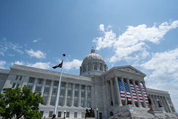 Missouri State Capitol Building in Jefferson City, Missouri with American Flag displayed - obrazy, fototapety, plakaty