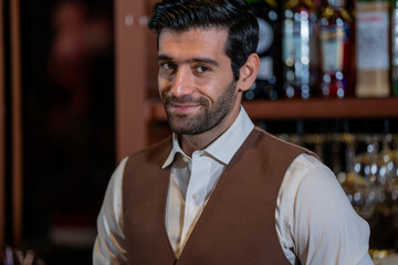 Man bartender is making a drink and dancing at bar. Dance party with group people dancing . Women and men have fun and drinking martini cocktail in night club.