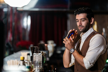 Man bartender is making a drink and dancing at bar. Dance party with group people dancing . Women and men have fun and drinking martini cocktail in night club.
