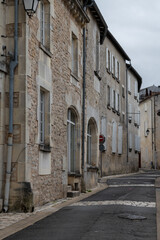 Fototapeta na wymiar View on old streets and houses in Cognac white wine region, Charente, walking in town Cognac with strong spirits distillation industry, France