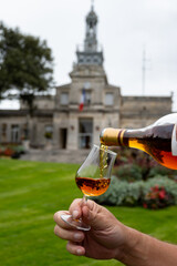 Tasting of cognac alcohol drink and view on old streets and houses in town Cognac, Grand Champagne,...