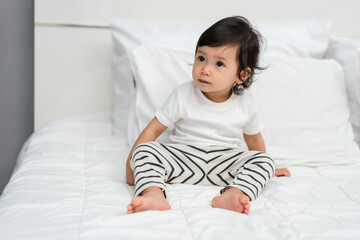 toddler baby on bed