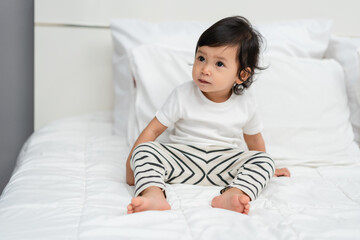 Fototapeta premium toddler baby on bed