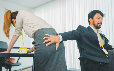 boss or supervisor is touching the buttocks of a female employee with his hand. This made the...
