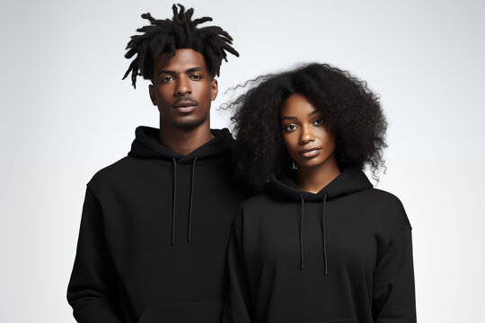 Black couple in blank black hoodie on gray background for clothing mockup