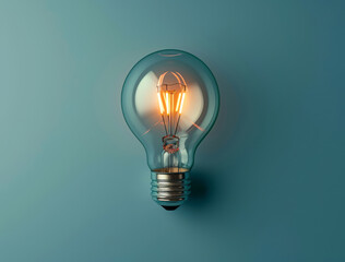 A light bulb, shining on a blue background, is presented, showcasing vintage modernism, eco-friendly craftsmanship, clever wit, and colors of light cyan and gray. - obrazy, fototapety, plakaty