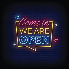 Neon Sign we are open with brick wall background vector