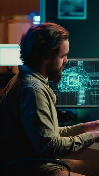 Vertical video Deviant AI superintelligence enslaving its creator, controlling his limbs, doing robotic movements. Rogue artificial intelligence possessing man, threating humanity, camera A