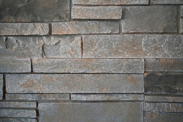 Closeup of gray slate hearth with stones in mosaic pattern