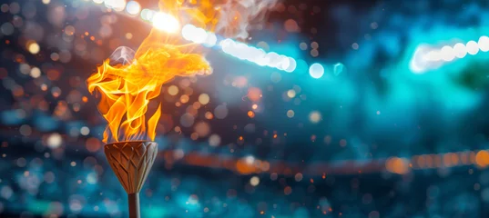 Tuinposter Blurred olympic torch flame burning in sports arena with space for text © pijav4uk