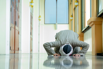 Ramadan, Muslim, Isalam, An Asian Muslim man is praying with peace in the beautiful mosque, giving...