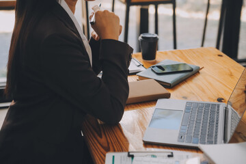 Asian women are stressed while working on laptop, Tired asian businesswoman with headache at office, feeling sick at work, copy space