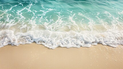 Fototapeta na wymiar Holiday summer background. Soft wave of the sea on the sandy beach.