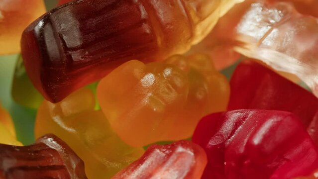 Jelly marmalade cola bottle bear close up, Confiture Bean candy jujube Marmalade bears with cod cannabis close up. 