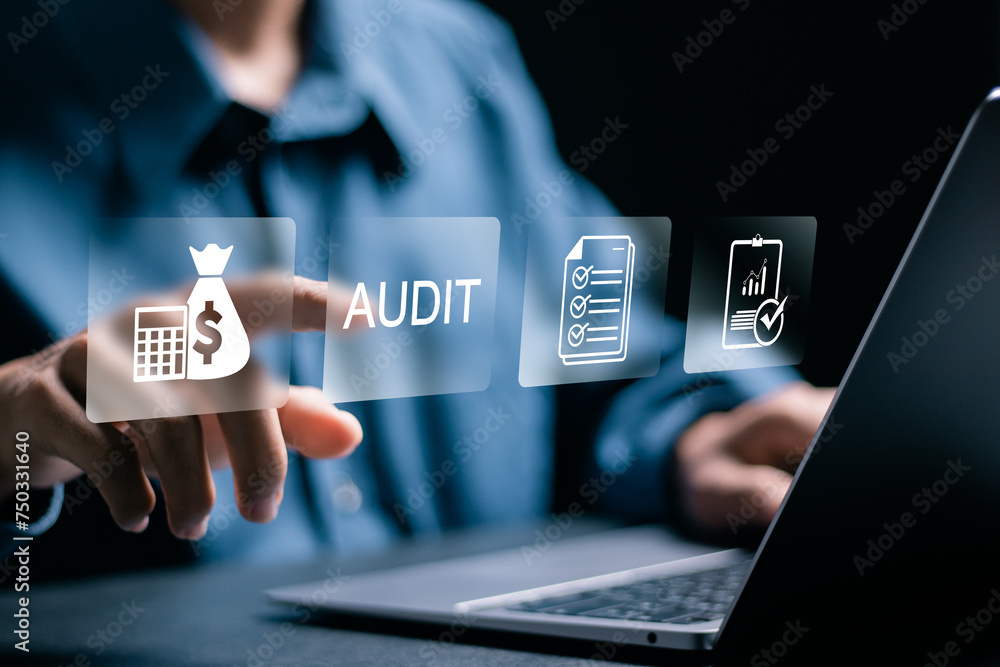 Aufkleber audit business concept. businessman using laptop computer to audit and evaluate corporate financial 