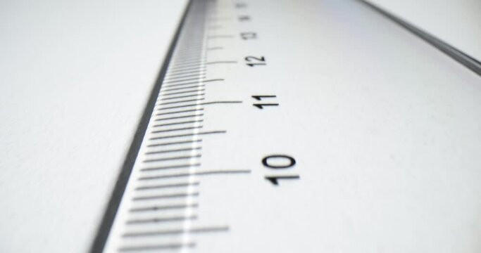 Plastic transparent ruler on white paper