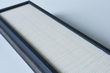 Air filter on a white background. New air filter.