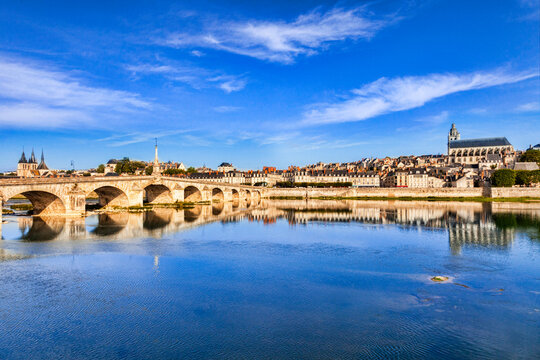 Blois Loire Valley France, the old town and bridge on the banks of the Loire at twilight.