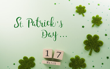 Happy St Patrick's Day decoration concept made from shamrocks ( clover leaf) and wooden calendar on...