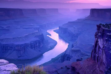 Foto op Canvas A beautiful river flowing through a canyon with purple skies in the background © hakule